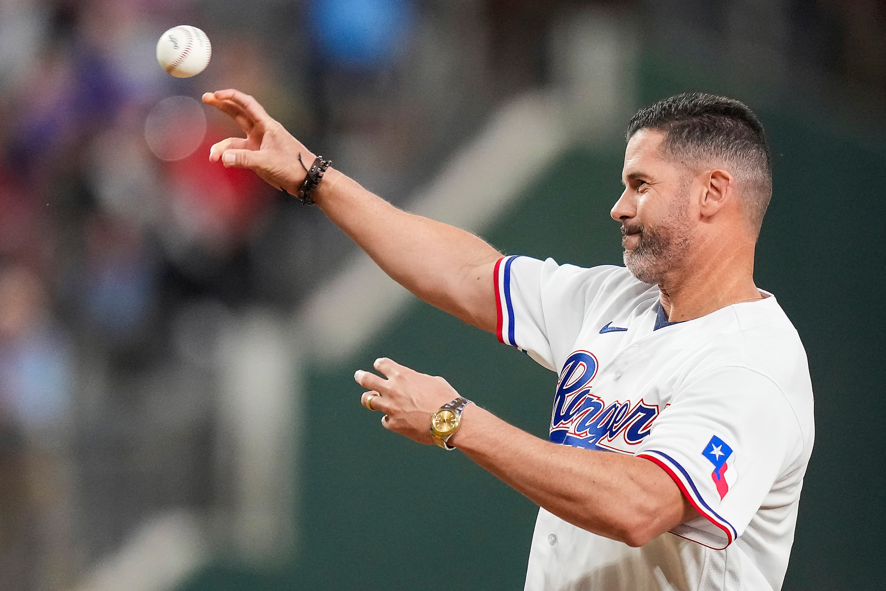 Former Texas Rangers Michael Young throws a ceremonial first pitch prior to Game 4 of the...