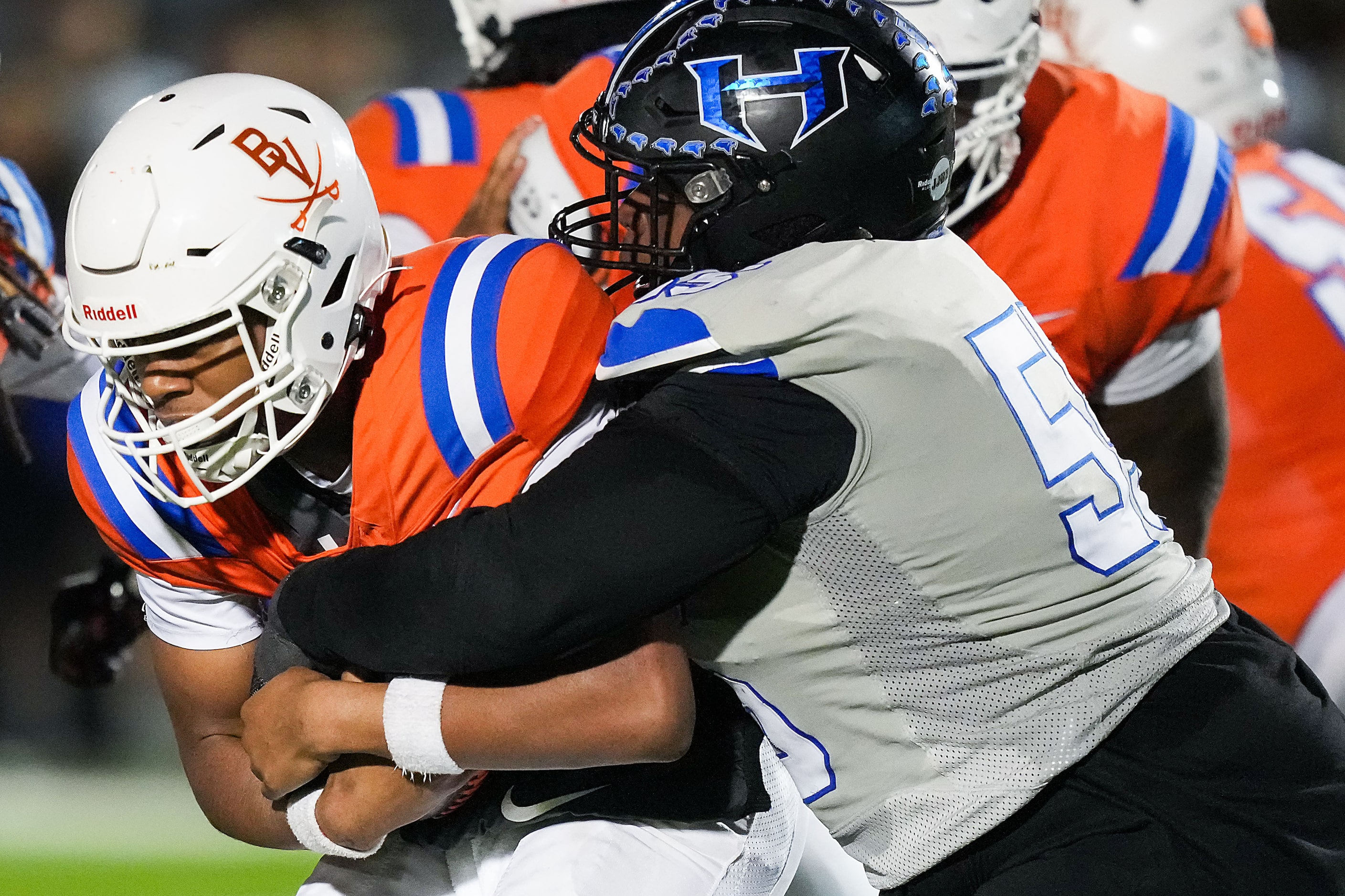 Arlington Bowie quarterback Jayden Bibbs (10) is sacked by Hebron defensive lineman Daylon...