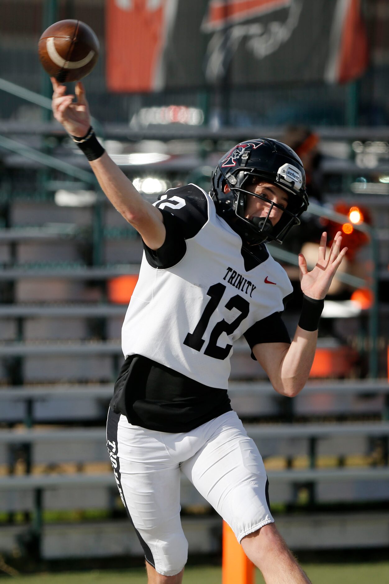 Euless Trinity quarterback Cade Barthelemess (12) throws a pass against Haltom during their...