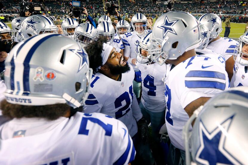 Dallas Cowboys running back Ezekiel Elliott (21) gets his teammates fired up before facing...