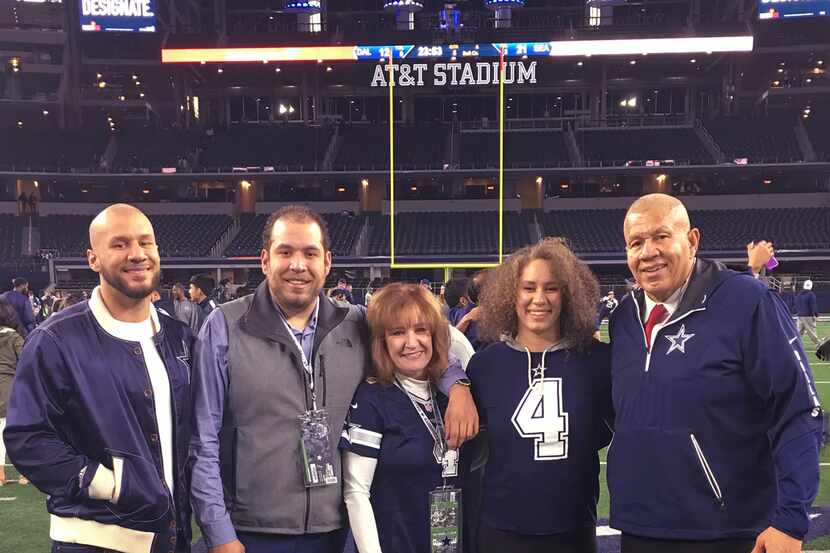 The Dupree family on the field at AT&T Stadium. From left, sons Taylor and Corey, mom Sue,...