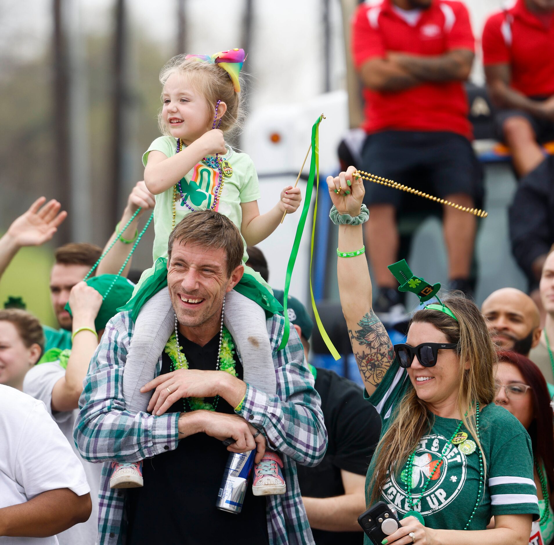 Crowd cheers during a Saint Patrick's Day parade on Saturday, March 11, 2023 along...