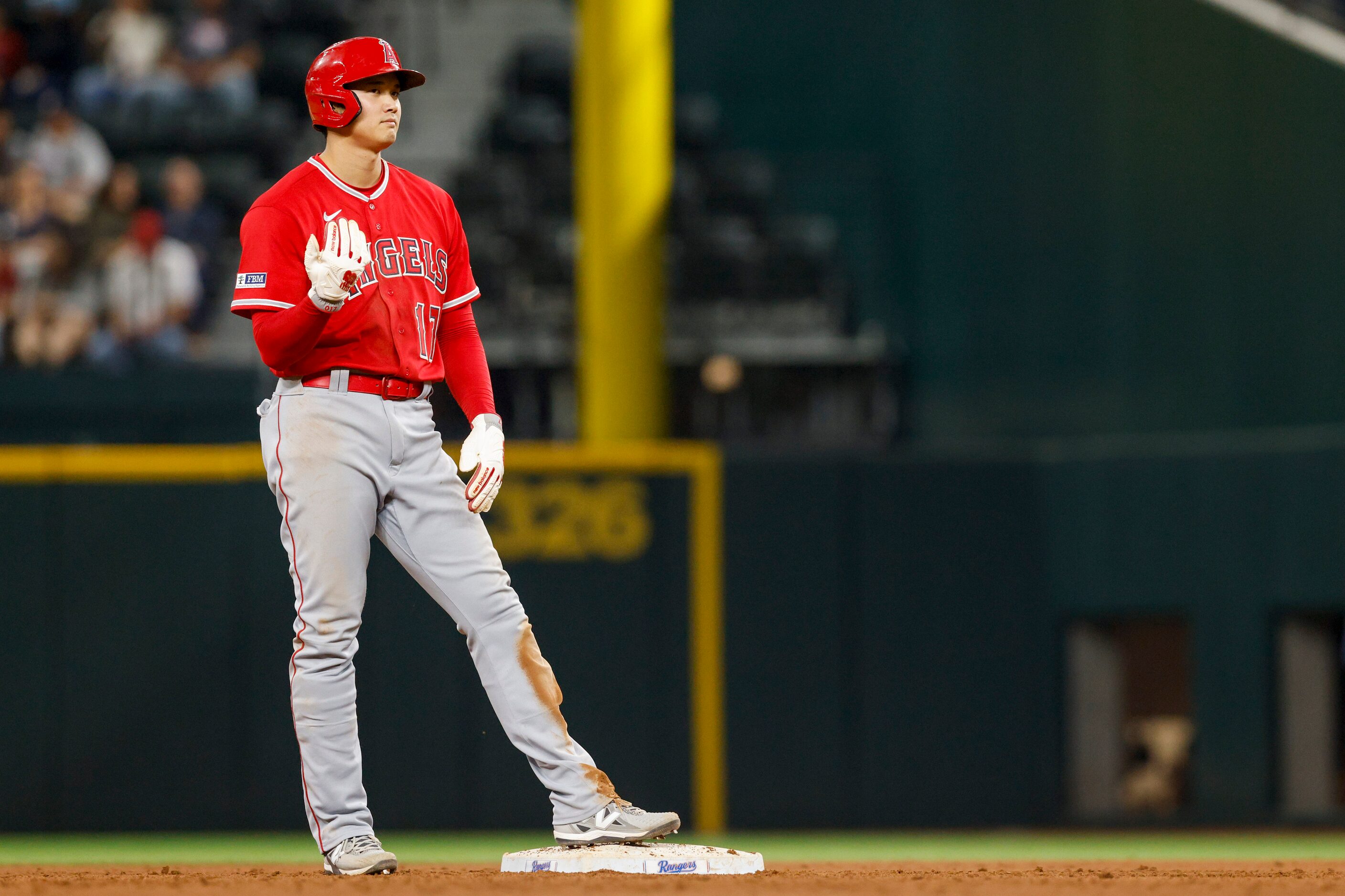 Los Angeles Angels designated hitter Shohei Ohtani (17) motions to the dugout after stealing...