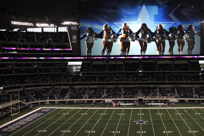 A video montage plays on the giant video board of the Dallas Cowboys Cheerleaders before...