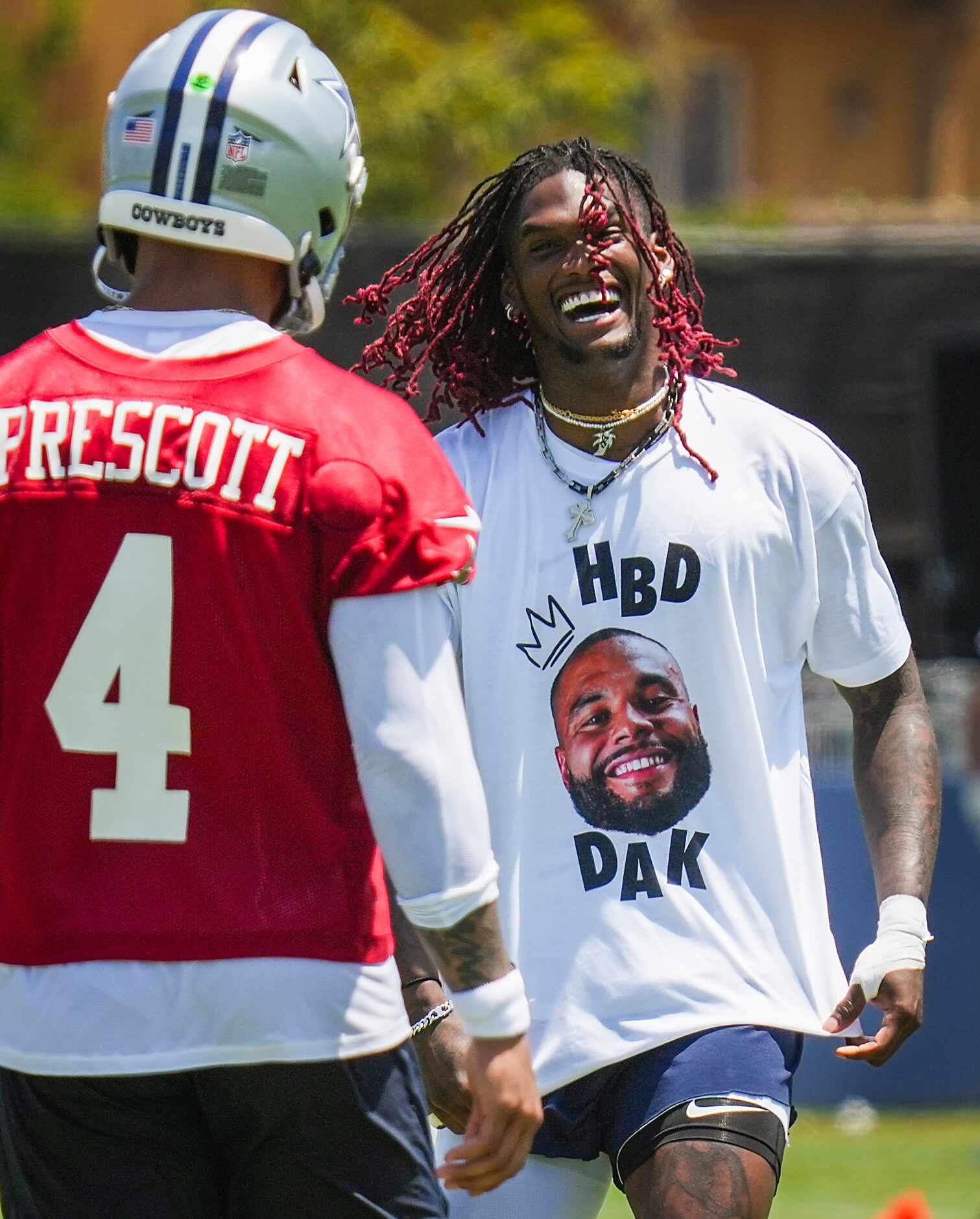 Dallas Cowboys wide receiver CeeDee Lamb (88) shows off a t-shirt reading “HBD Dak” to...