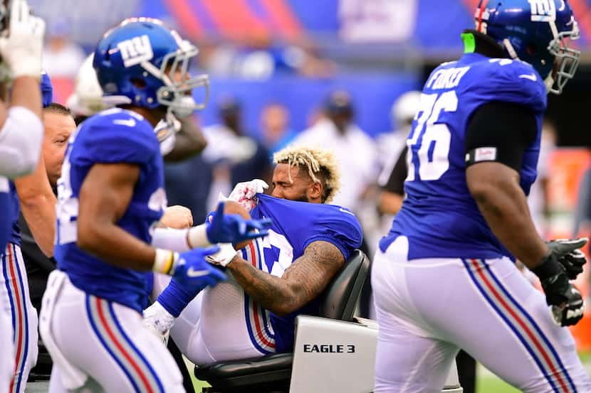 EAST RUTHERFORD, NJ - OCTOBER 08: Odell Beckham #13 of the New York Giants is carted off the...