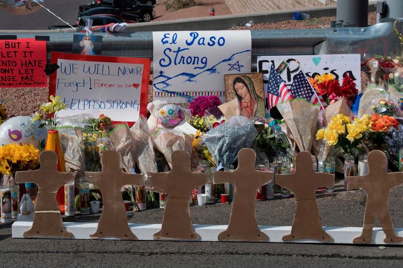 Crosses at a makeshift memorial are seen after the shooting that left 22 people dead at the...