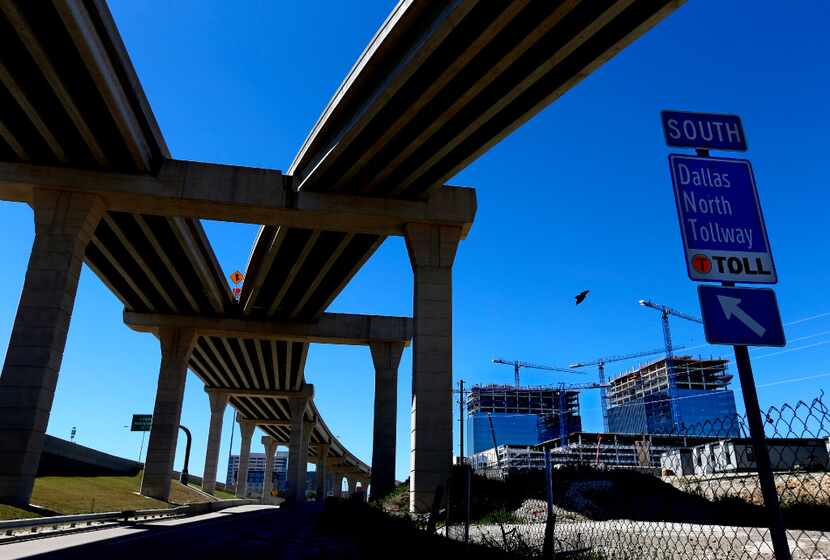 The Dallas North Tollway borders buildings under construction for the Liberty Mutual complex...