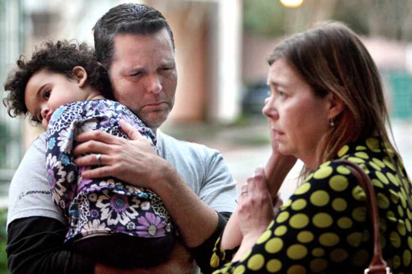 Matt and his wife Melanie Capobianco try to hold back tears just before they must turn onver...