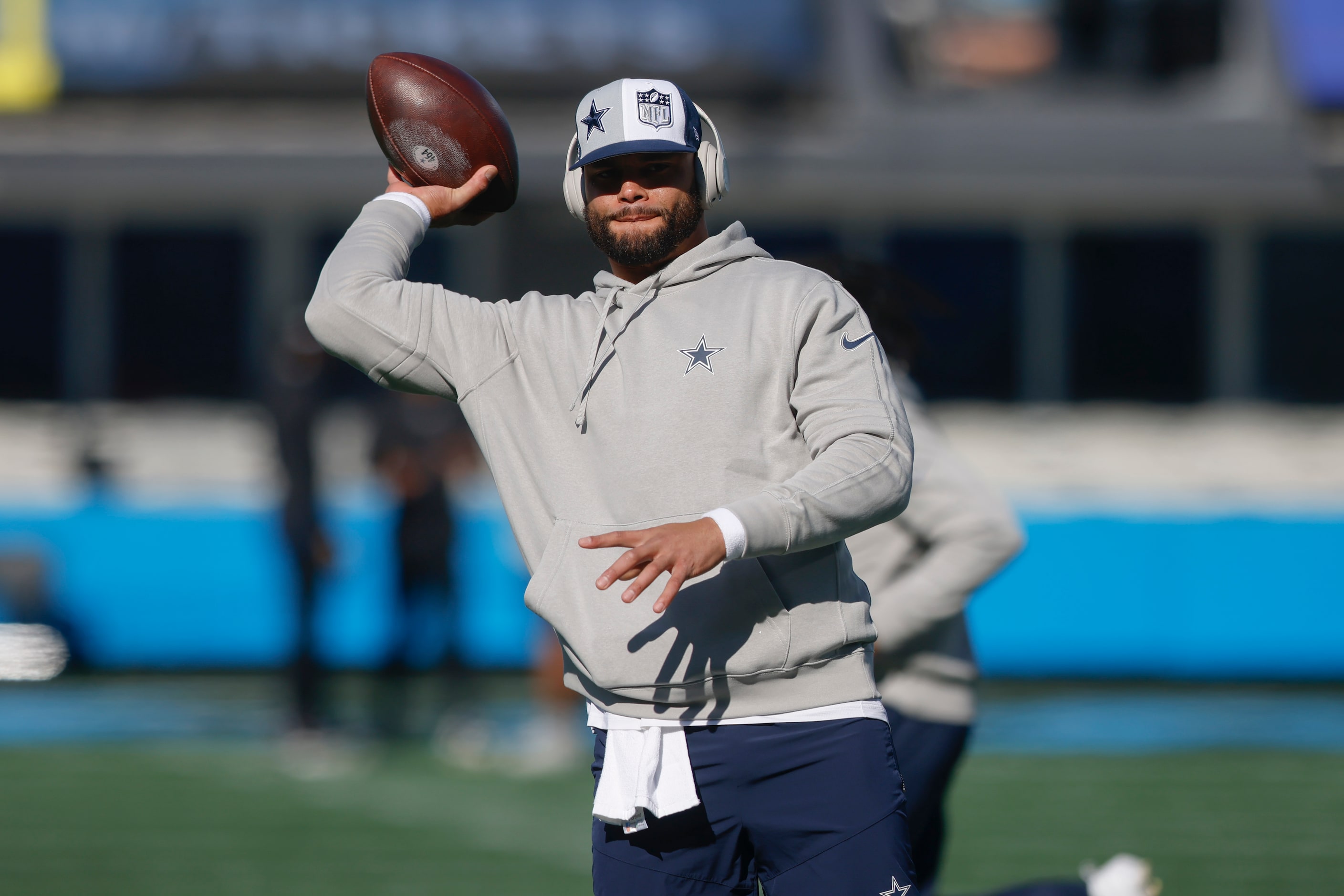 Dallas Cowboys quarterback Dak Prescott (4) throws the ball while warming up before an NFL...