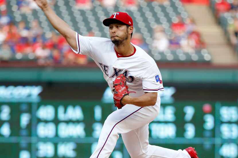 Texas Rangers starting pitcher Yu Darvish (11) pitches in the first inning at Globe Life...