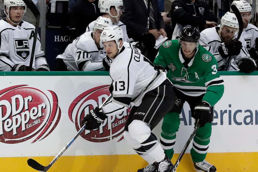 Los Angeles Kings left wing Kyle Clifford (13) controls the puck in front of Dallas Stars...