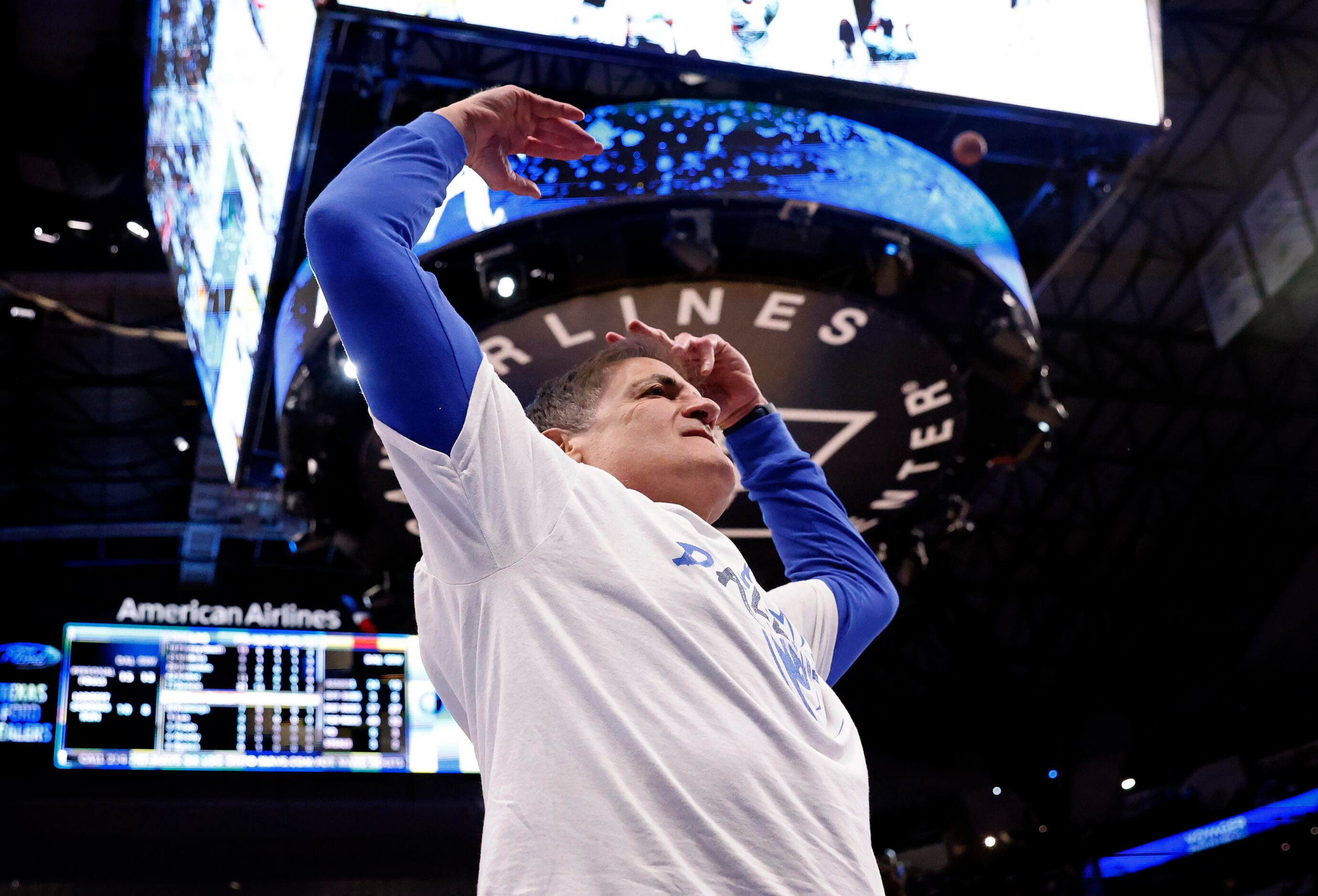 Dallas Mavericks owner Mark Cuban tries to get the crowd fired up during the first half in...