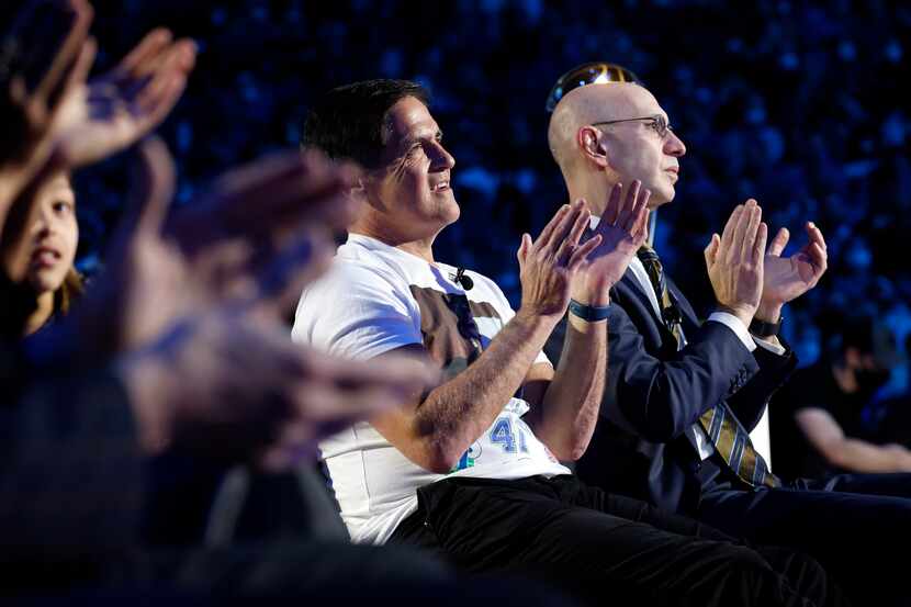Dallas Mavericks owner Mark Cuban and NBA Commissioner Adam Silver (right) applaud former...