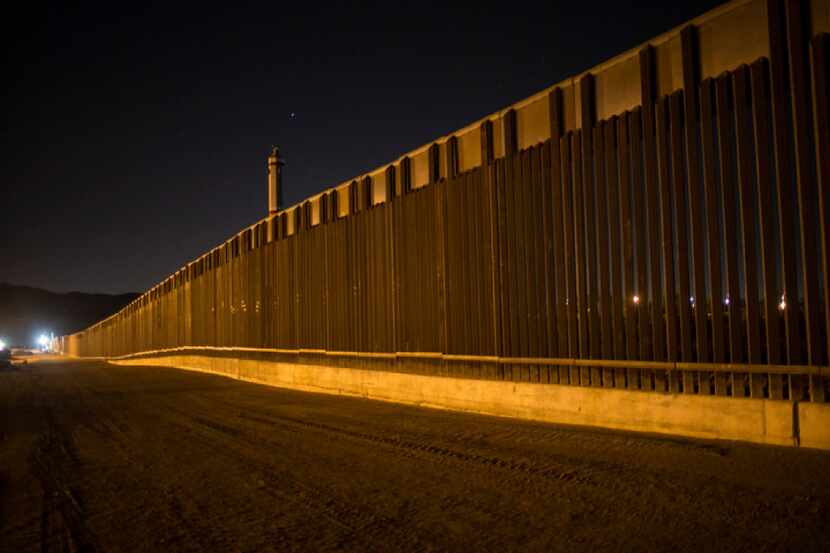 In this March 30, 2017 file photo, a portion of the new steel border fence stretches along...