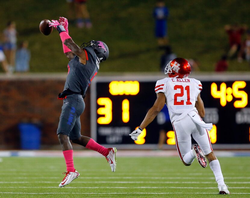 Southern Methodist Mustangs defensive back Rodney Clemons (8) tries to intercept a pass...