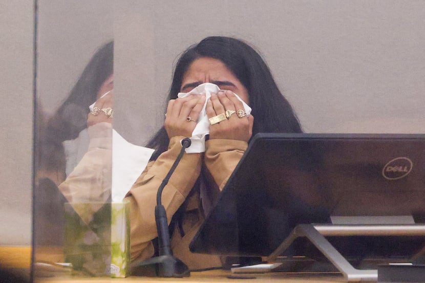 Yatziry Jaramillo, daughter of Jaime Jaramillo, wipes away tears while testifying during the...