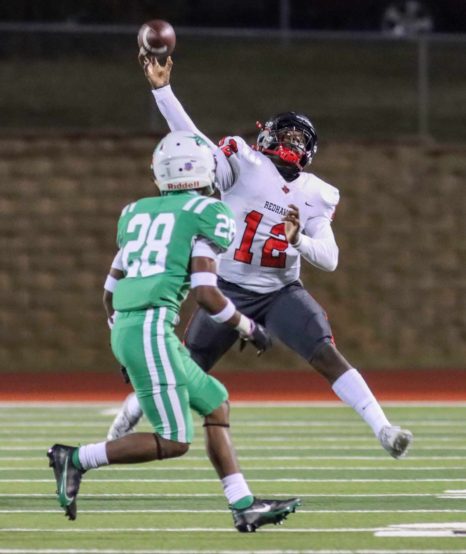 Frisco Liberty quarterback Keldric Luster (12) throws a pass over Lake Dallas defensive back...