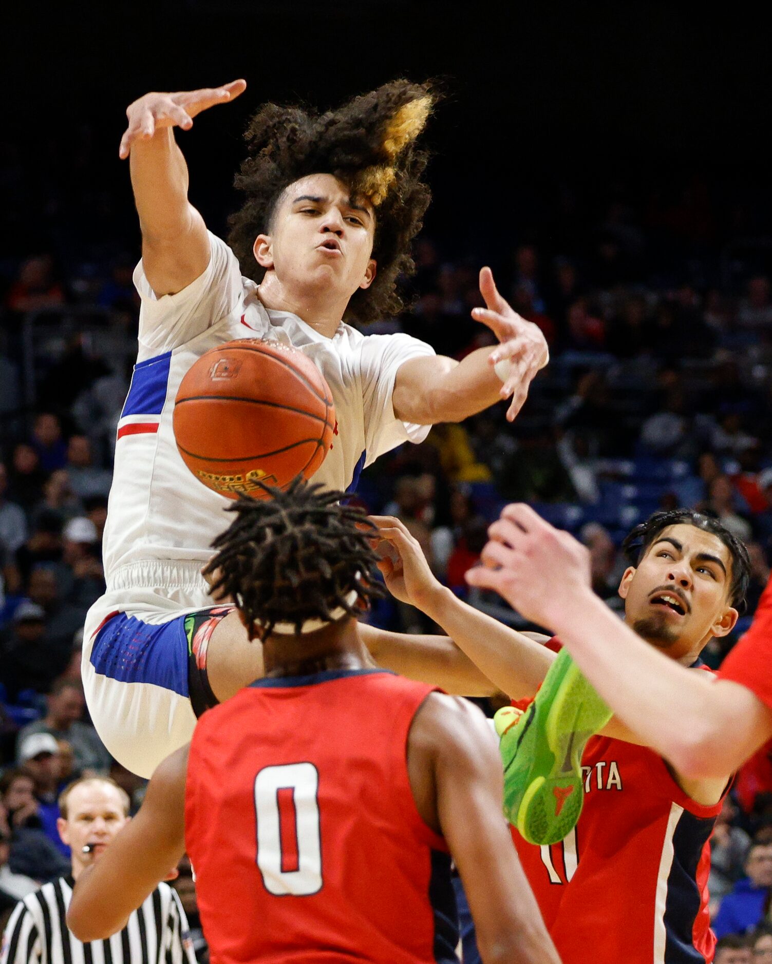 Humble Atascocita guard Gabe Acay (11) knocks the ball loose from Duncanville guard Anthony...