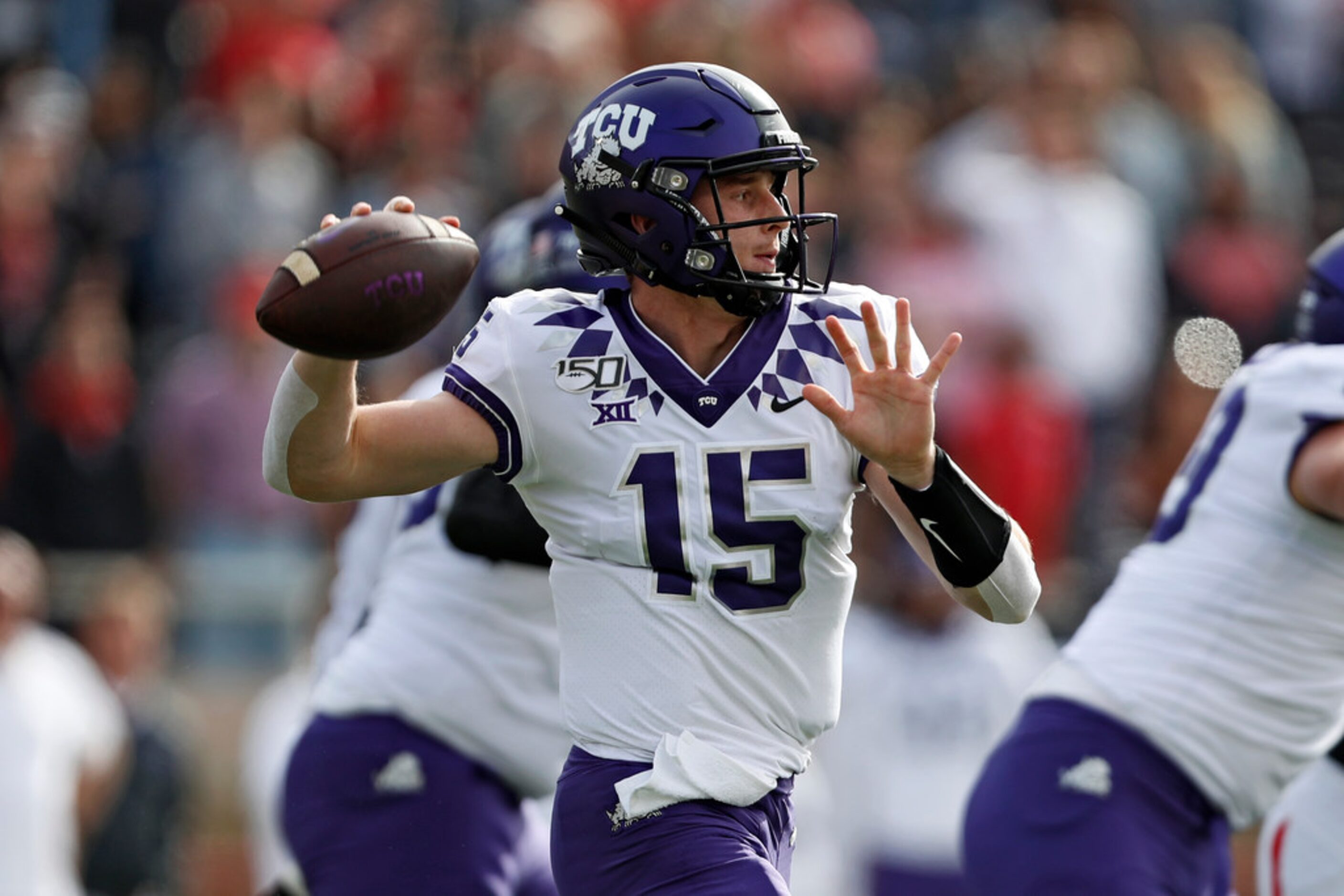 TCU's Max Duggan (15) passes the ball during the first half of an NCAA college football game...