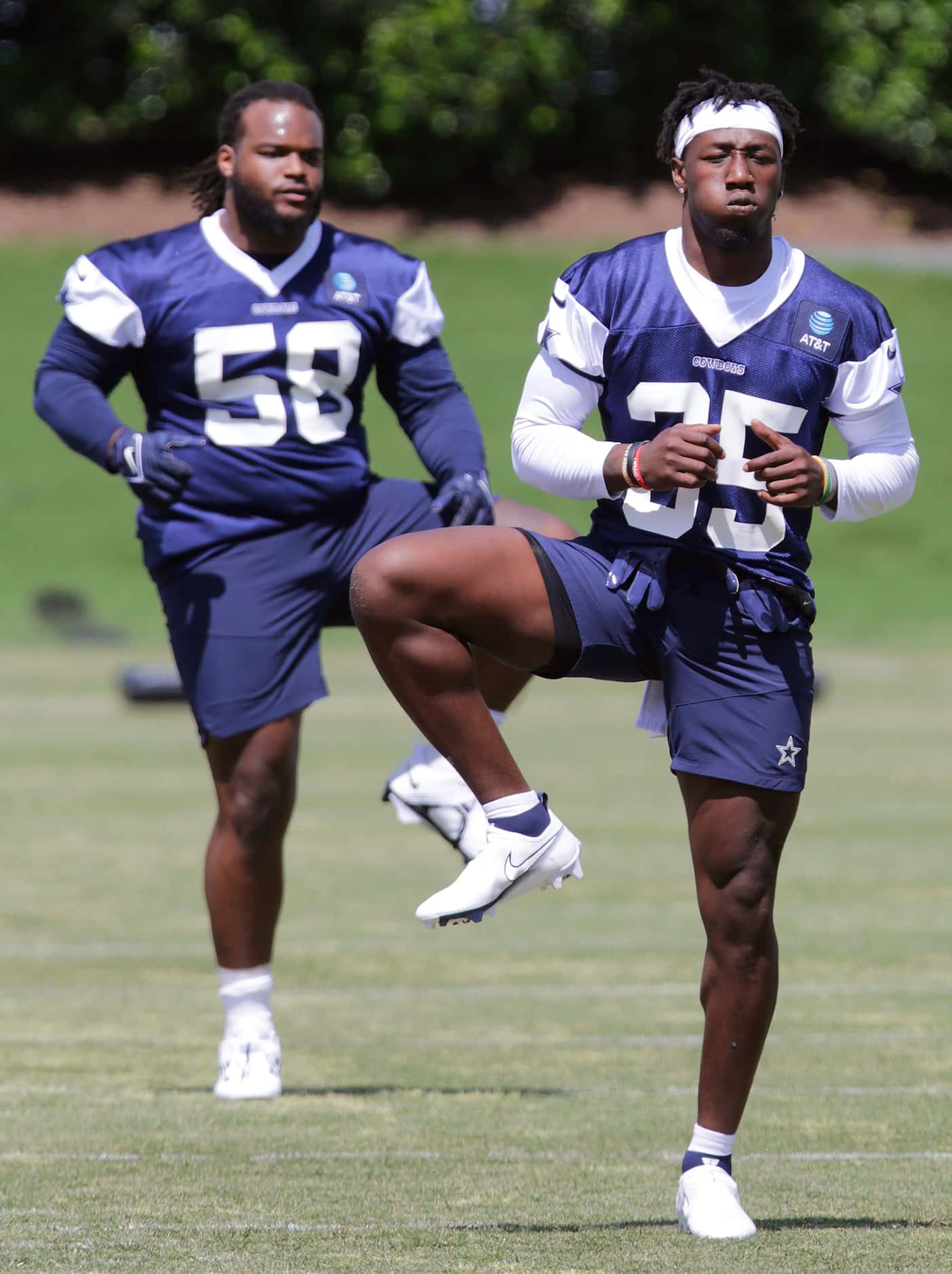 Cowboys rookie defensive tackle Mazi Smith (58) and rookie linebacker DeMarvion Overshown...