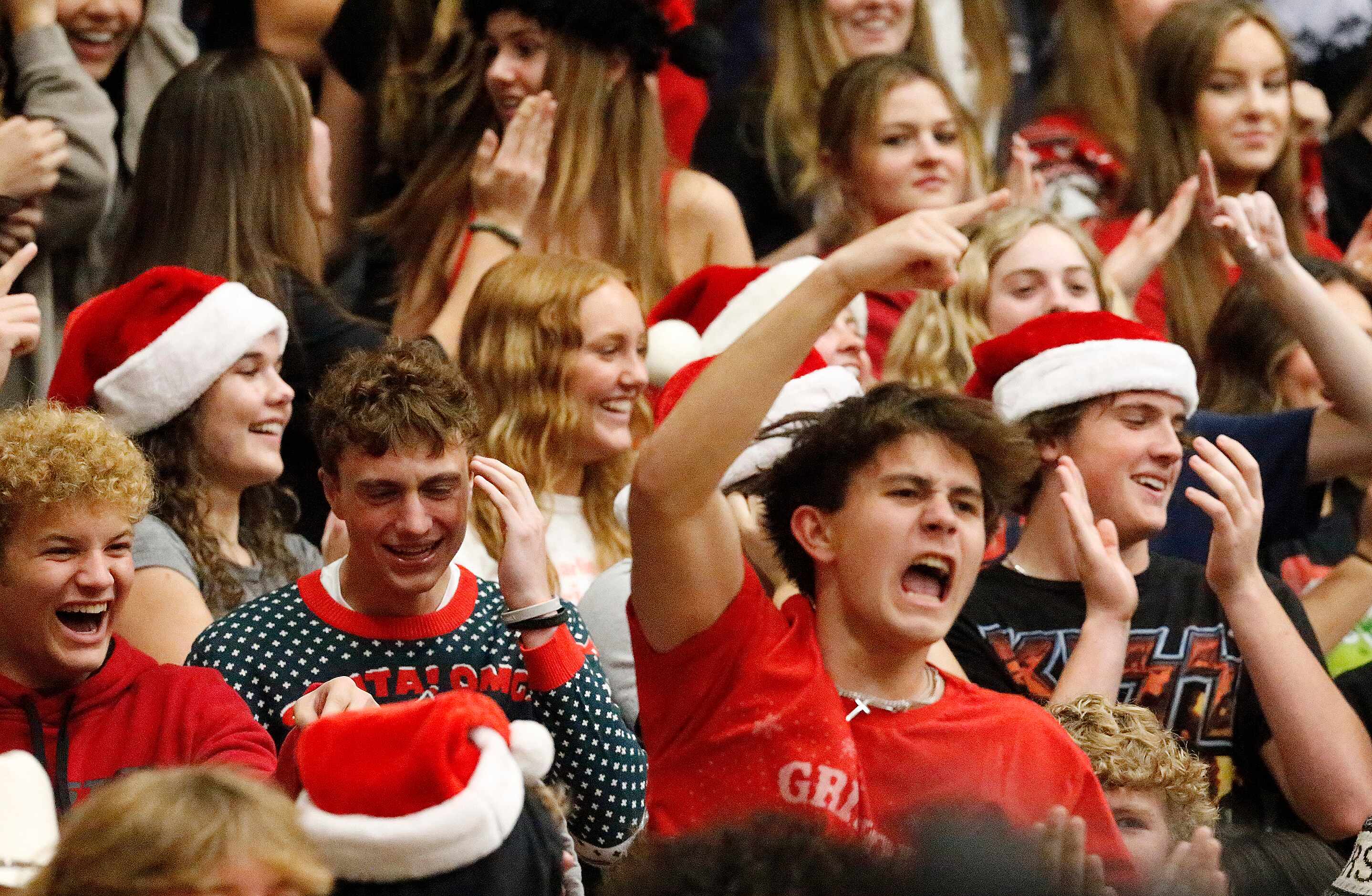 Prosper High School students react to winning game two as Plano West High School played...
