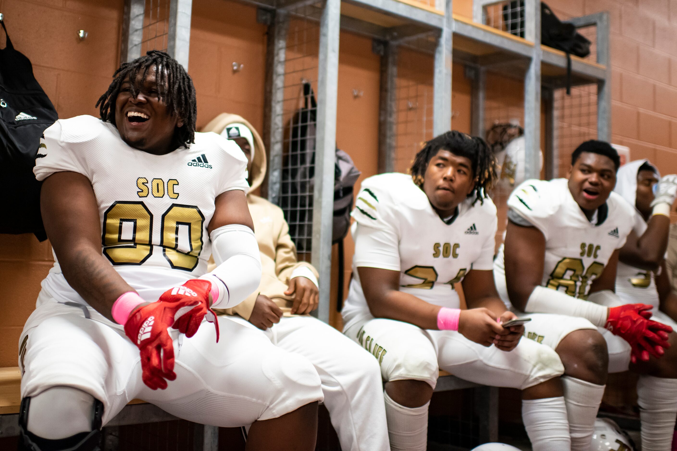 South Oak Cliff senior Tyler Young (90) sings with his teammates during halftime of the...