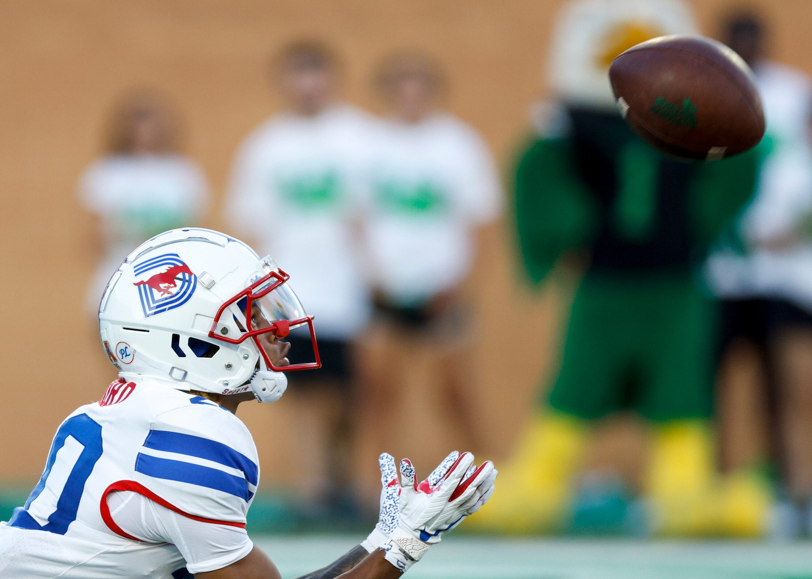 SMU wide receiver Jayleen Record (20) catches a kick-off during the first quarter of a game...