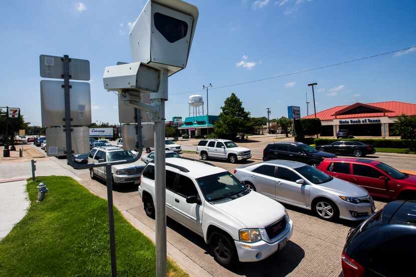 A red light camera is posted on Wednesday, July 6, 2016 at the intersection of Belt Line...