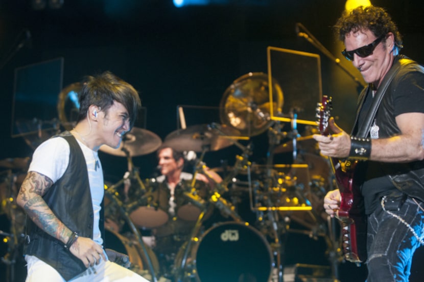 Arnel Pineda, left, lead singer of Journey and Guitarist Neal Schon perform at the Gexa...