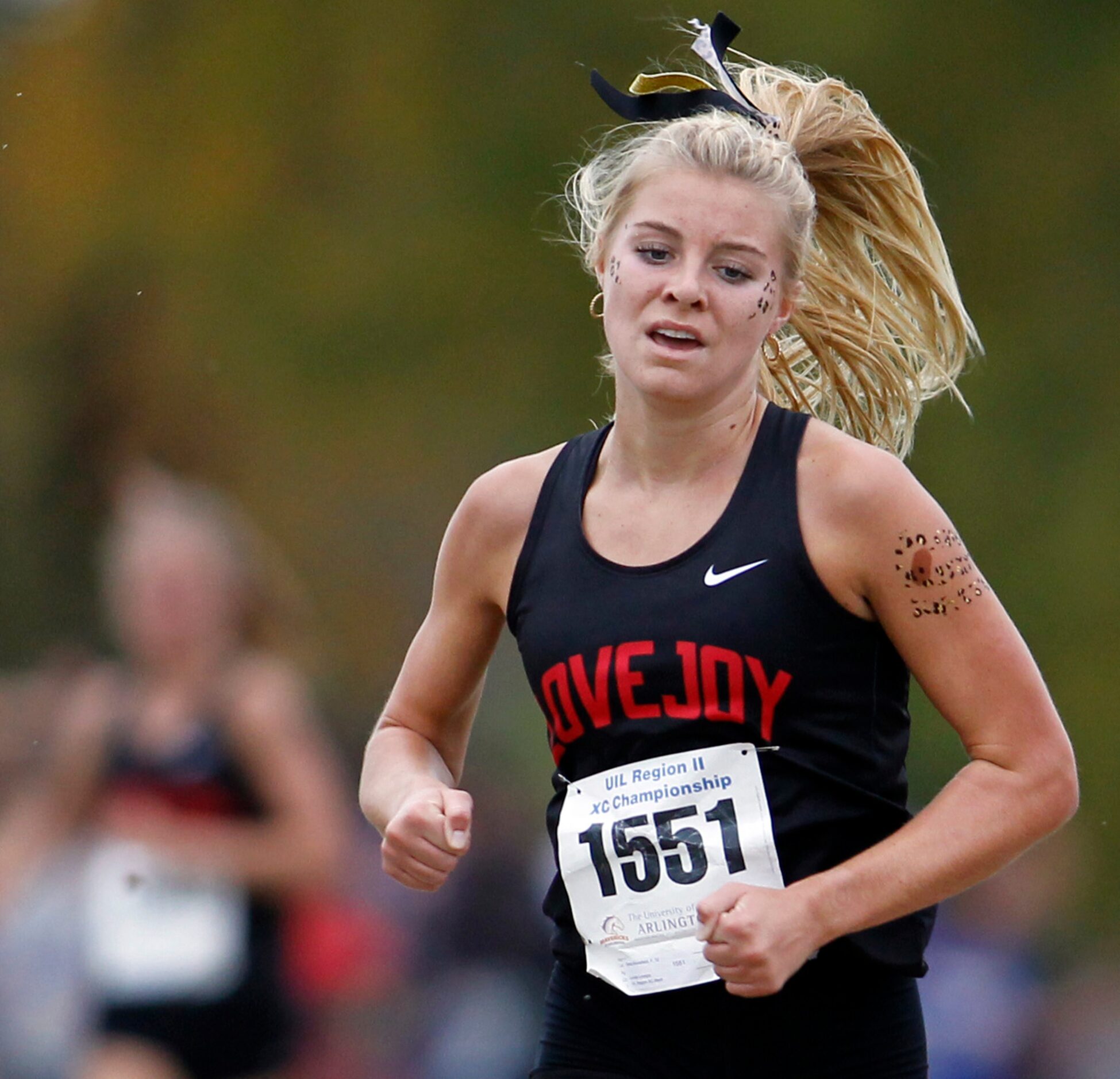 Lucas Lovejoy senior Sara Morefield (1551) heads to the finish line to win the 5A Girls...