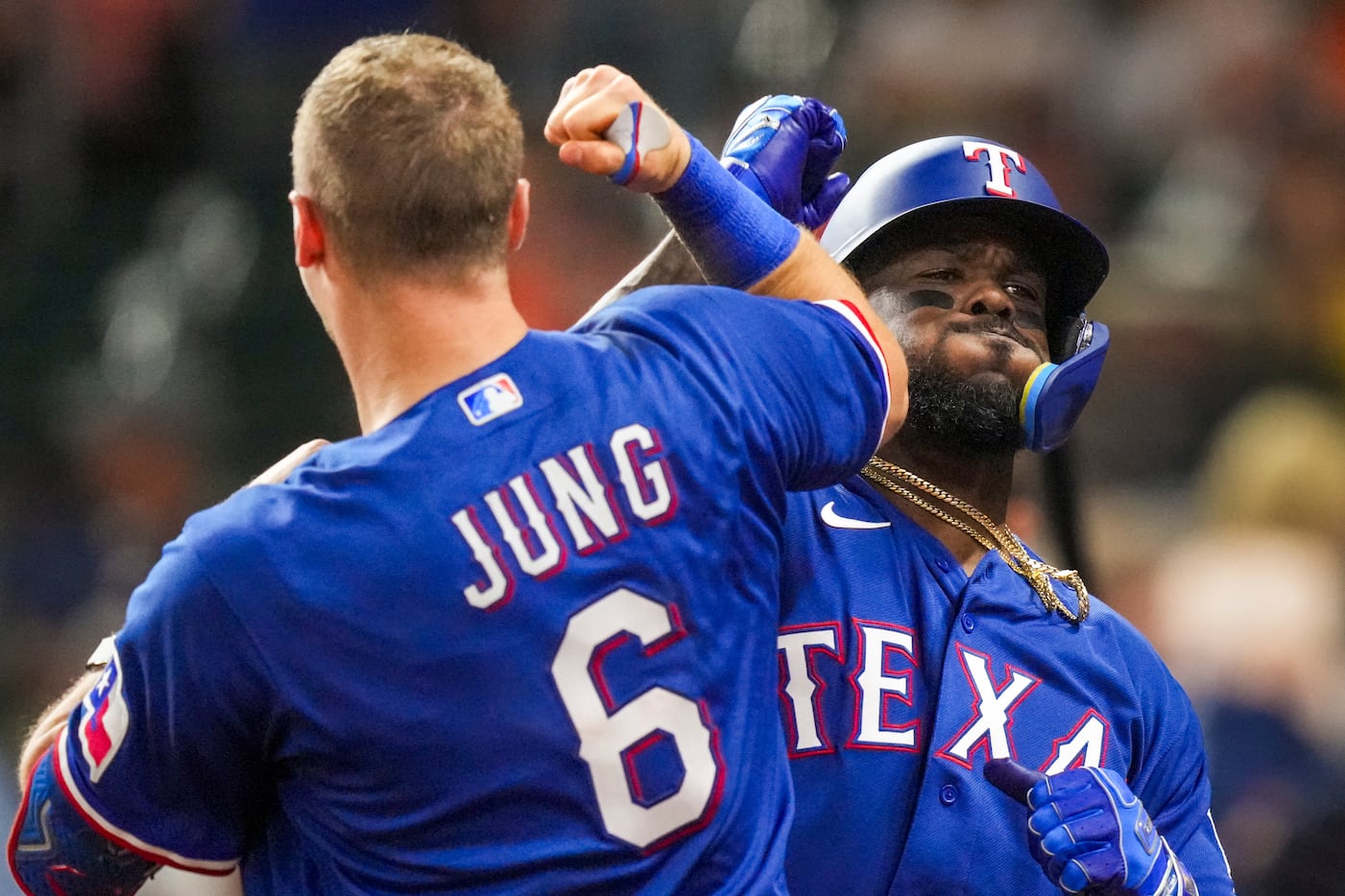 Texas Rangers right fielder Adolis Garcia celebrates with third baseman Josh Jung after...