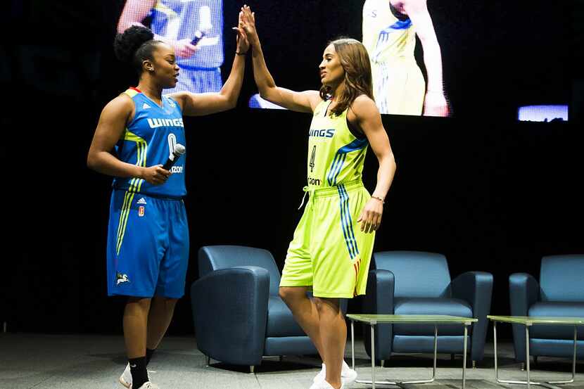Dallas Wings guards Odyssey Sims (left) and Skylar Diggins take the stage as the team...