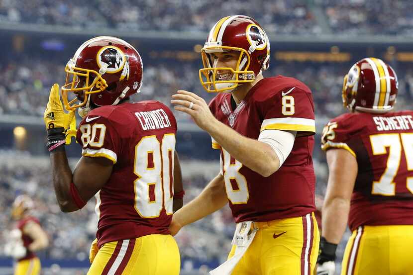 Washington Redskins quarterback Kirk Cousins (8) congratulates Washington Redskins wide...