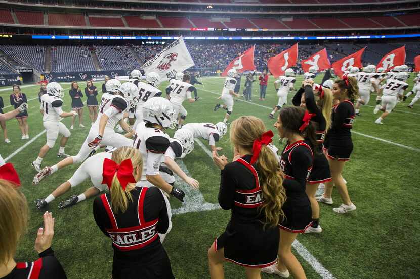 Argyle players tumble as the take the field before the Class 4A Division I state...