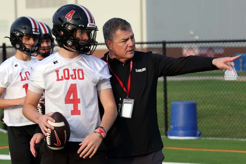 Lucas Lovejoy head coach Todd Dodge directs quarterback Jacob Janecek (4) to the details of...