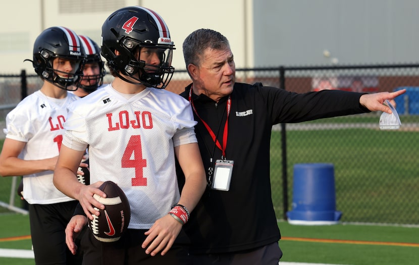 Lucas Lovejoy head coach Todd Dodge directs quarterback Jacob Janecek (4) to the details of...