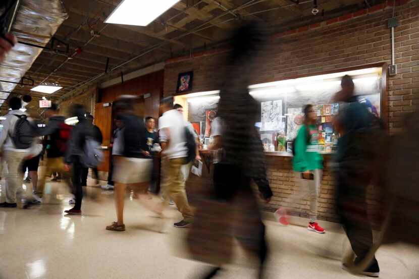 
Students walk in a hallway between classes at Bryan Adams. Next year, the school plans to...