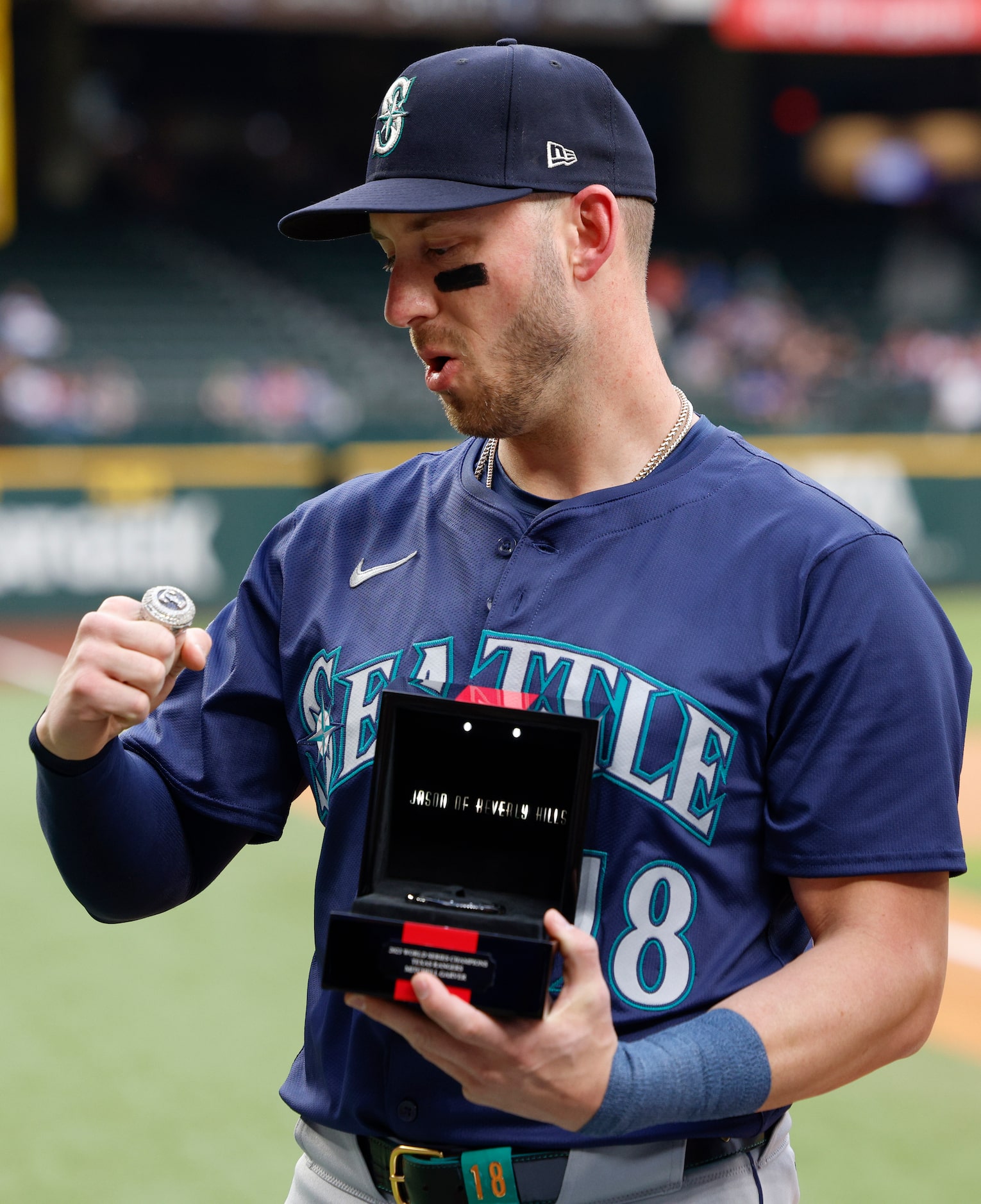 Former Texas Rangers catcher Mitch Garver reacts after seeing his 2023 World Series...