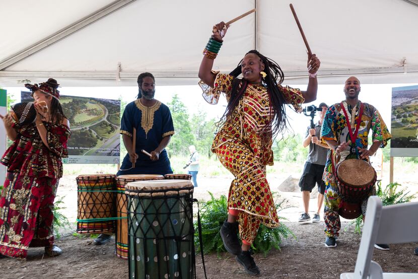 Tonya Compton (center) performs with the Bandan Koro African Drum and Dance Ensemble during...