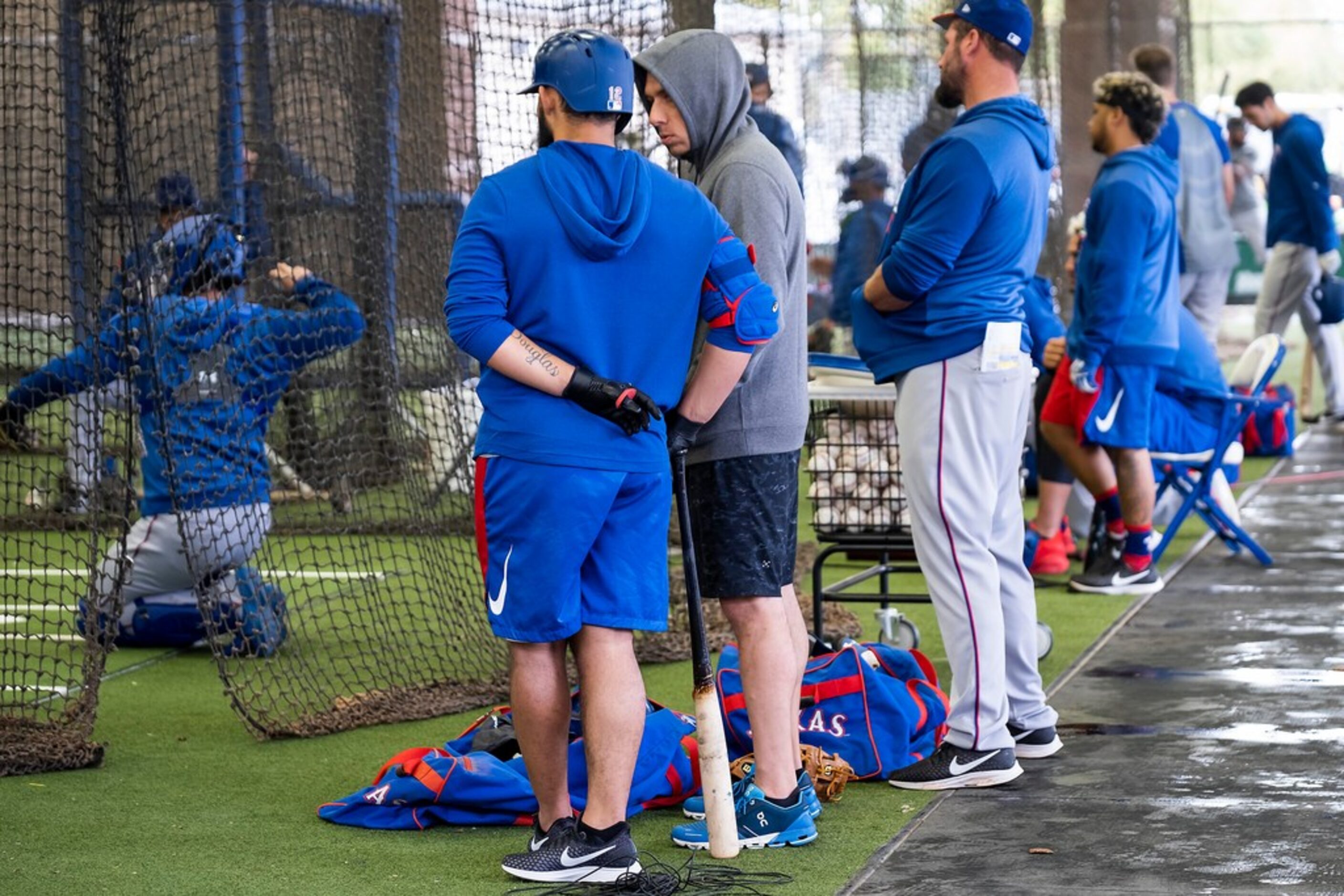 Texas Rangers general manager Jon Daniels talks with infielder Rougned Odor in the batting...