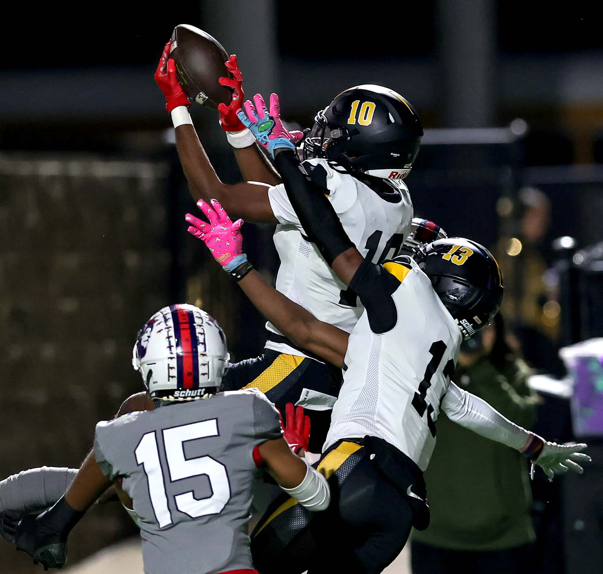 Forney wide receiver Kofi Eduful (10) goes up high and comes down with a reception against...