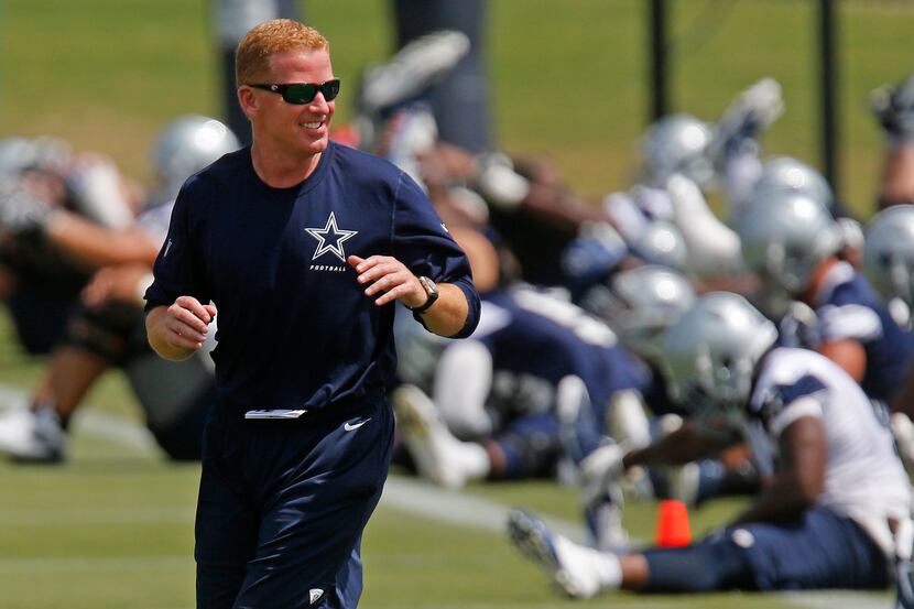 Dallas Cowboys coach Jason Garrett answers a question during a news conference at the NFL...