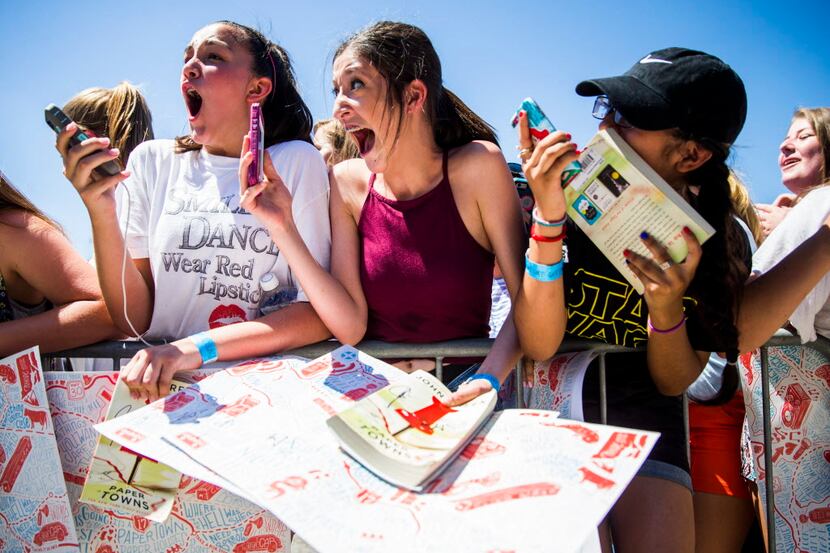 From left, Ariana Hickman, 14, Ashlyn Palmer, 15, and Melanie Faz, 13, react to seeing...
