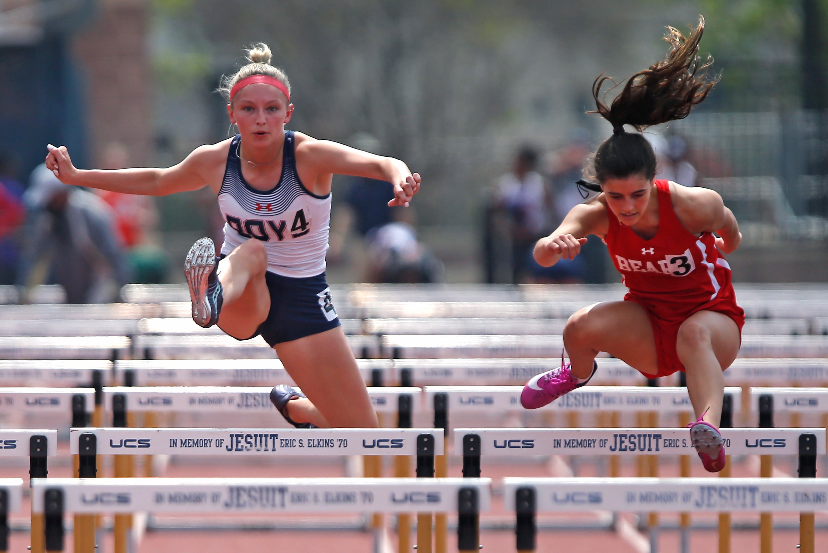 McKinney Boyd High School’s Delaney Goheen (left), 17, competes with Emi Diaz, 14, of...