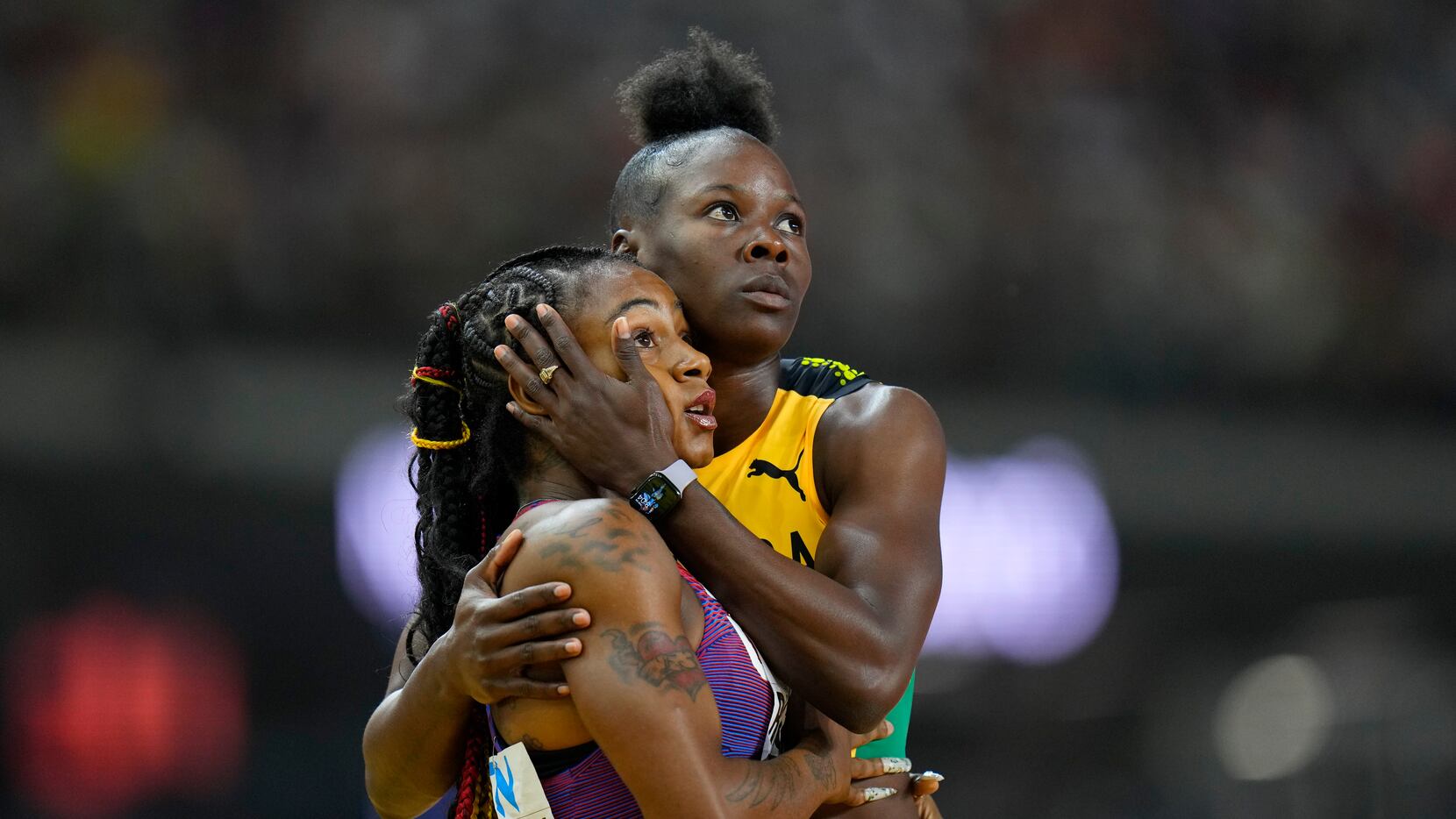 Shericka Jackson, of Jamaica, right, embraces Sha'Carri Richardson, of the United States,...