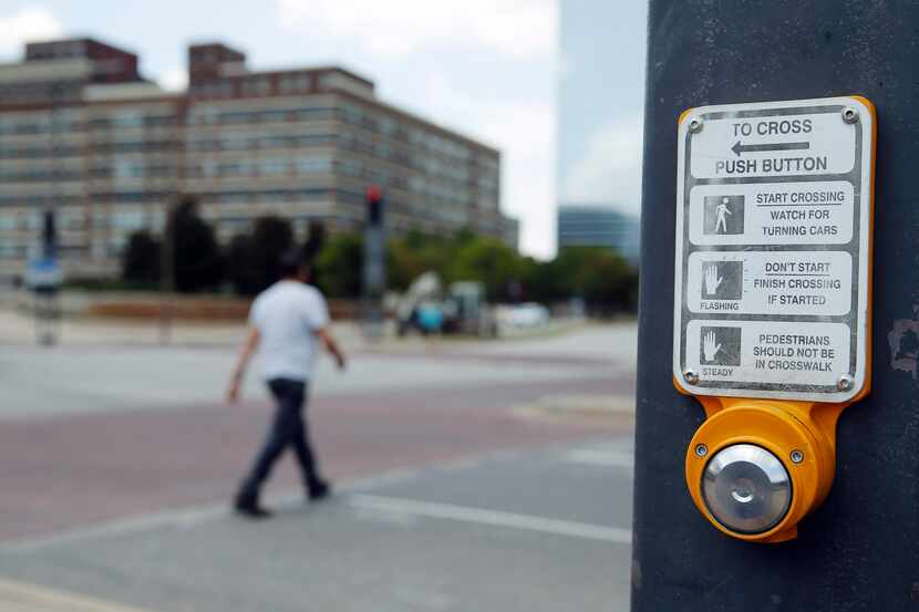 Push button for crosswalk signal in downtown Dallas.