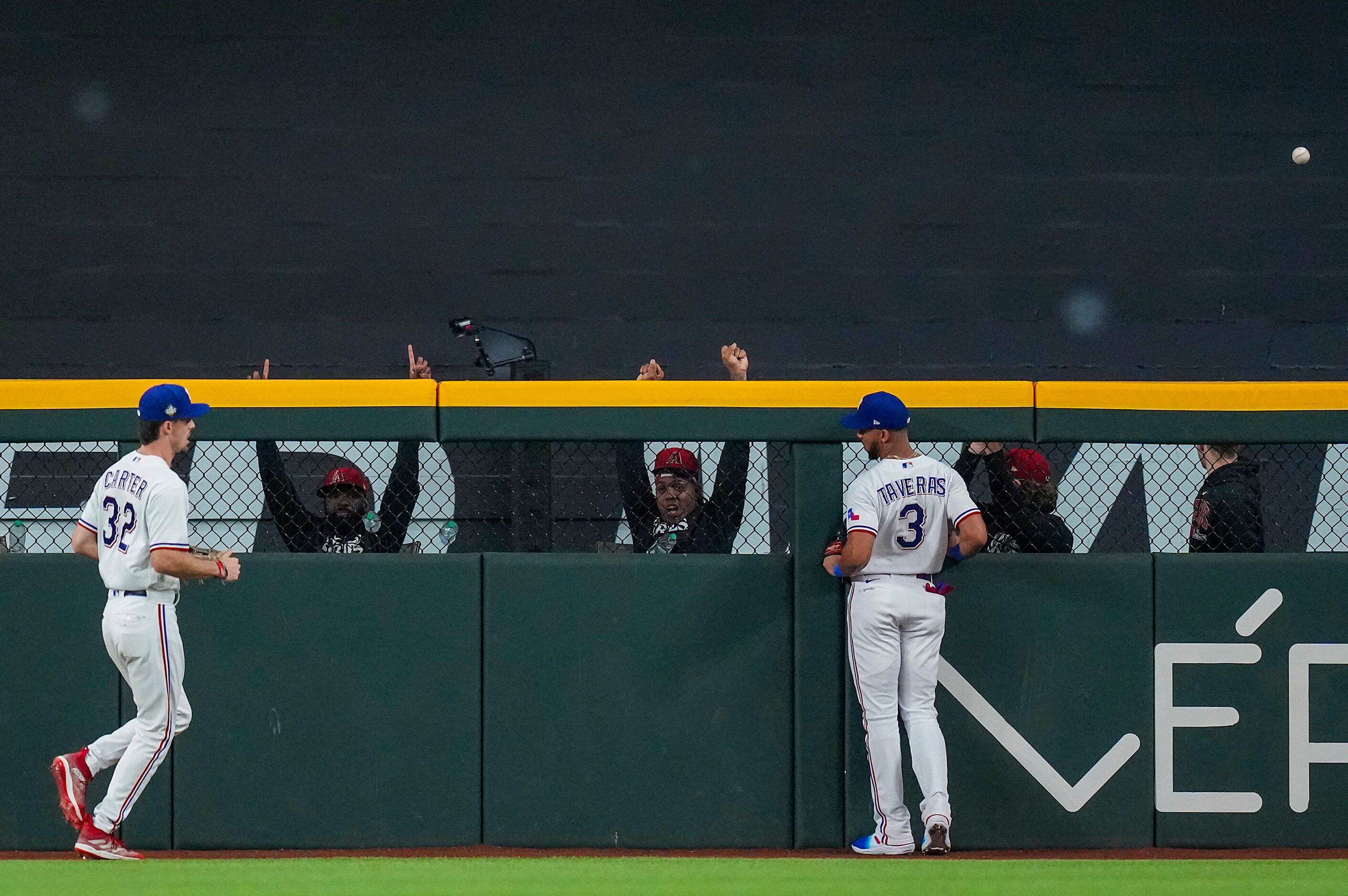 Pitchers in the Arizona Diamondbacks bullpen celebrate as Texas Rangers center fielder Leody...