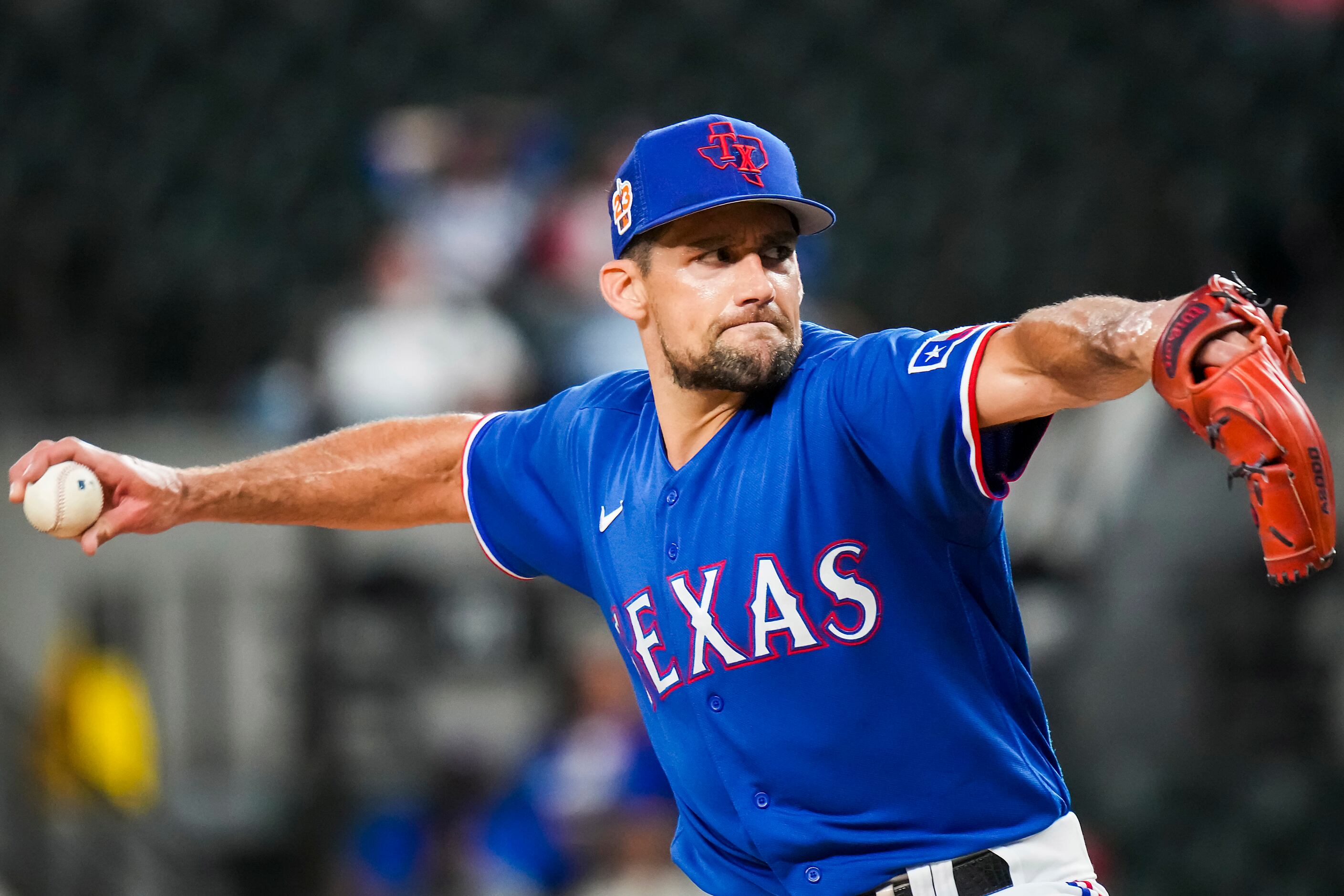 Texas Rangers starting pitcher Nathan Eovaldi delivers during the first inning of an...