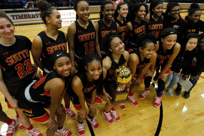 Sporting a smile almost as big as the bi-district trophy she was holding, South Grand...